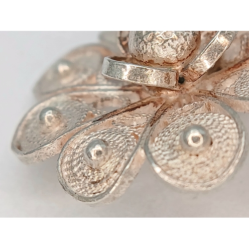 29 - A Lovely Vintage Silver Filigree Floral Spray Brooch - 4.5cm length. The brooch has a floral and lea... 