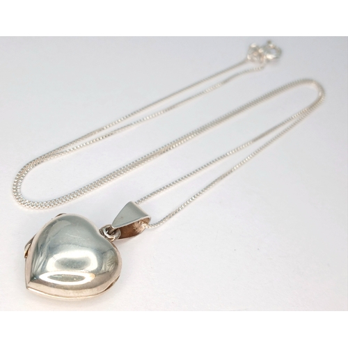 49 - A 925 Sterling Silver Heart Locket Pendant Necklace - 46cm length. The necklace is fitted with a pol... 