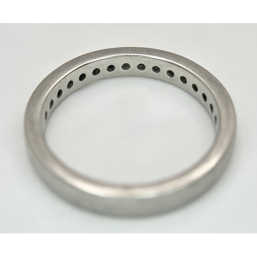 43 - A 950 Platinum and Diamond Half Eternity Ring. 4mm width. Size M 1/2. 5.7g total weight. Channel and... 