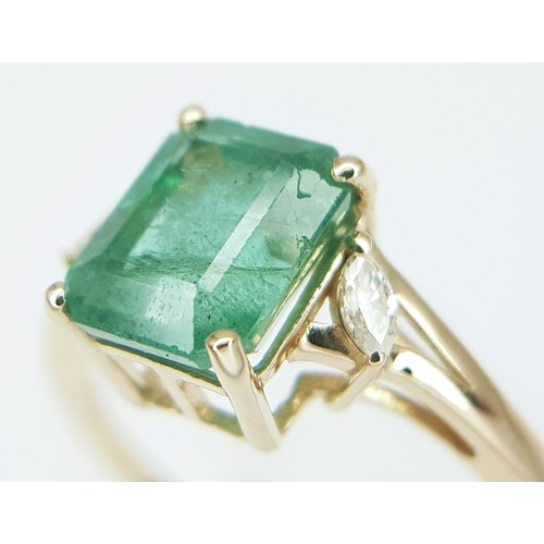 74 - A 14K Yellow Gold Natural Emerald and Diamond Ring. A 1.83ct octagon step cut natural emerald with m... 