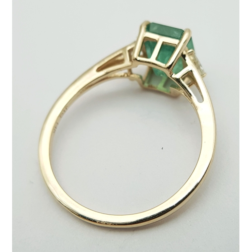 74 - A 14K Yellow Gold Natural Emerald and Diamond Ring. A 1.83ct octagon step cut natural emerald with m... 
