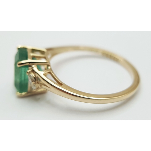 74 - A 14K Yellow Gold Natural Emerald and Diamond Ring. A 1.83ct octagon step cut natural emerald with m... 