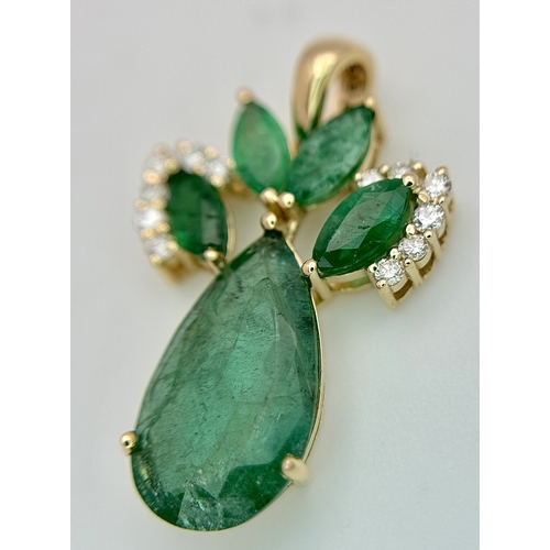81 - A 14K Yellow Gold Natural Emerald and Diamond Pendant. Five pear and marquise cut natural emeralds t... 