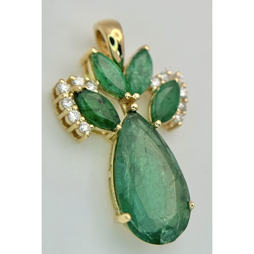 81 - A 14K Yellow Gold Natural Emerald and Diamond Pendant. Five pear and marquise cut natural emeralds t... 