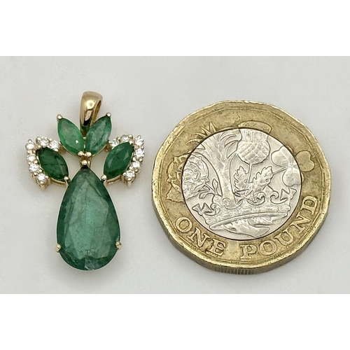 81 - A 14K Yellow Gold Natural Emerald and Diamond Pendant. Five pear and marquise cut natural emeralds t... 