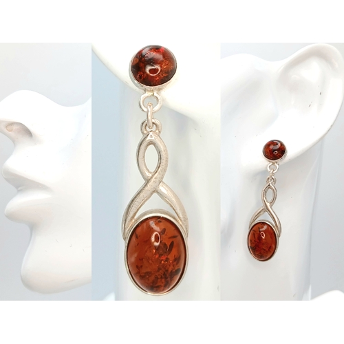 13 - A Pair of 925 Sterling Silver Amber Drop Earrings. 4.5cm drop. 5.8g total weight.