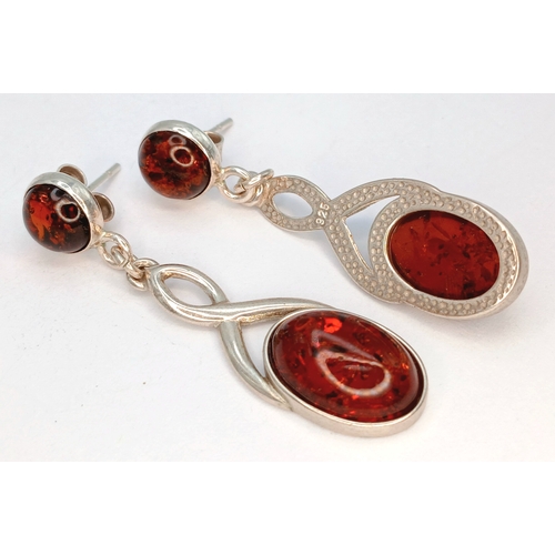 13 - A Pair of 925 Sterling Silver Amber Drop Earrings. 4.5cm drop. 5.8g total weight.