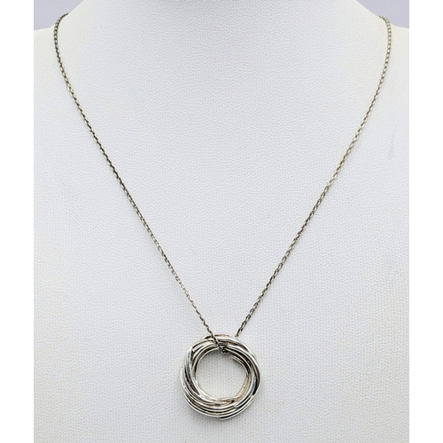 20 - A 925 Sterling Silver Circular Pendant Necklace. 46cm necklace. Pendant measures 2cm. 8g total weigh... 