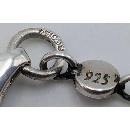 20 - A 925 Sterling Silver Circular Pendant Necklace. 46cm necklace. Pendant measures 2cm. 8g total weigh... 
