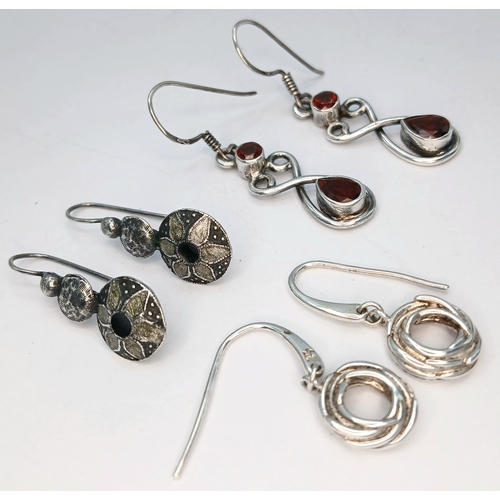 51 - A Collection of Three Pairs of 925 Sterling Silver Drop Earrings. Including a pair of floral engrave... 