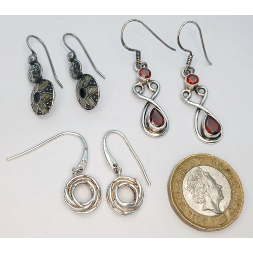 51 - A Collection of Three Pairs of 925 Sterling Silver Drop Earrings. Including a pair of floral engrave... 