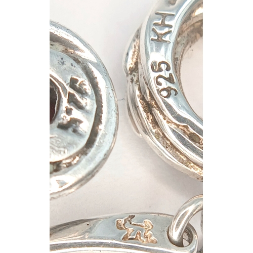 51 - A Collection of Three Pairs of 925 Sterling Silver Drop Earrings. Including a pair of floral engrave... 