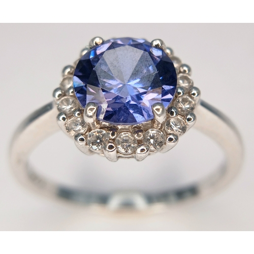 58 - A pretty 925 Sterling Silver CZ Blue Stone Dress Ring. The ring is set with a round faceted blue sto... 