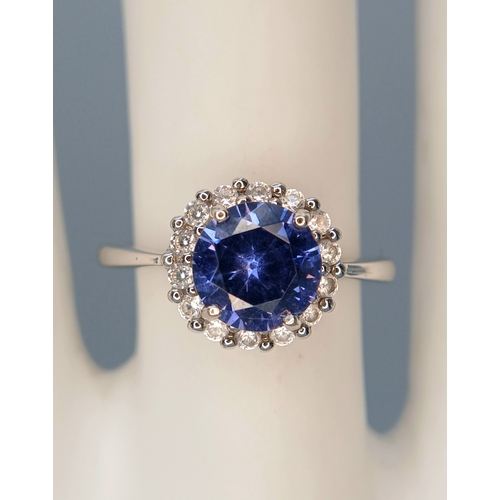 58 - A pretty 925 Sterling Silver CZ Blue Stone Dress Ring. The ring is set with a round faceted blue sto... 