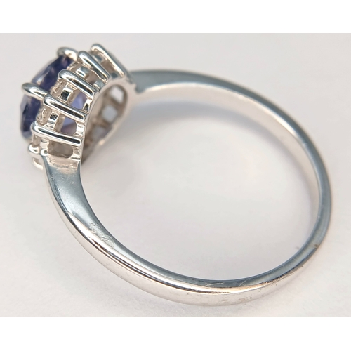 58 - A pretty 925 Sterling Silver CZ Blue Stone Dress Ring. The ring is set with a round faceted blue sto... 