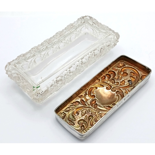6 - An Edwardian Sterling Silver Mounted Cut Glass Trinket Box. The rectangular cut glass box with a rem... 