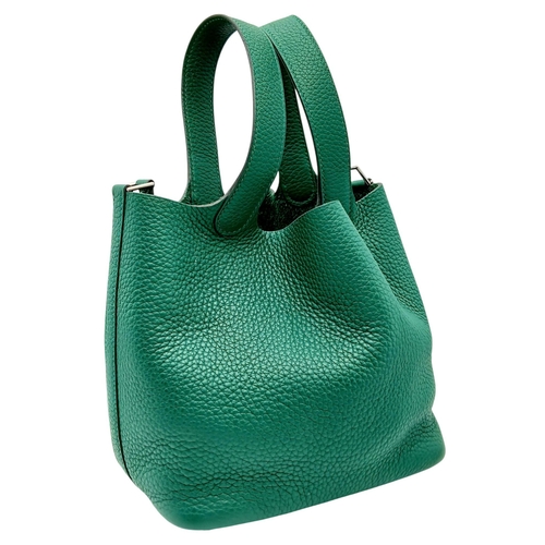 41 - An Hermès Picotin Lock Green Leather Handbag. Green leather exterior with dual top handles, silver-t... 