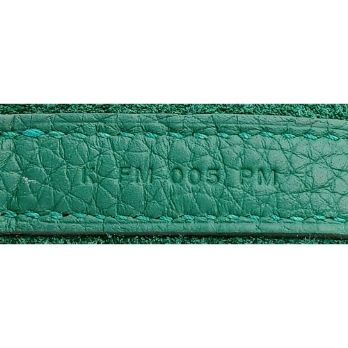 41 - An Hermès Picotin Lock Green Leather Handbag. Green leather exterior with dual top handles, silver-t... 