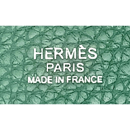 41 - An Hermès Picotin Lock Green Leather Handbag. Green leather exterior with dual top handles, silver-t... 