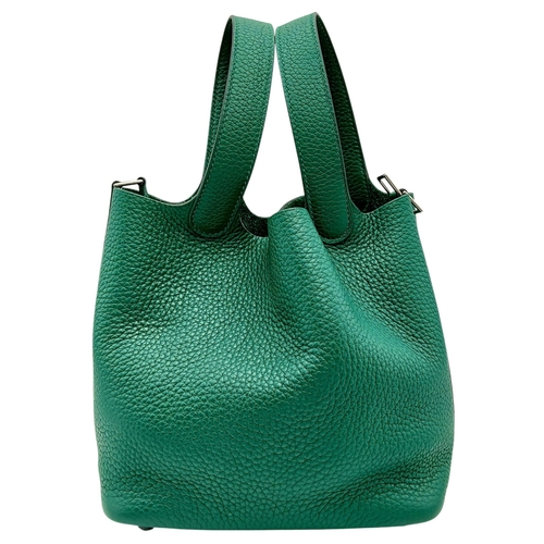 41 - An Hermès Picotin Lock Green Leather Handbag. Green leather exterior with dual top handles, silver-t... 