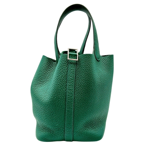 41 - An Hermès Picotin Lock Green Leather Handbag. Green leather exterior with dual top handles, silver-t... 
