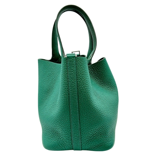 41 - An Hermès Picotin Lock Green Leather Handbag. Green leather exterior with dual top handles, silver-t... 