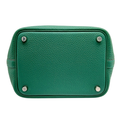 41 - An Hermès Picotin Lock Green Leather Handbag. Green leather exterior with dual top handles, silver-t... 