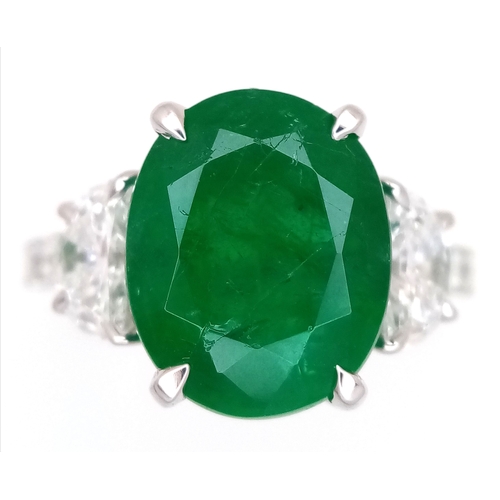 46 - A Stunning 950 Platinum Natural Emerald and Diamond Cocktail Ring. Set with an oval cut 5.69ct natur... 