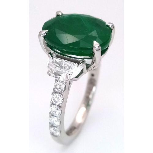 46 - A Stunning 950 Platinum Natural Emerald and Diamond Cocktail Ring. Set with an oval cut 5.69ct natur... 