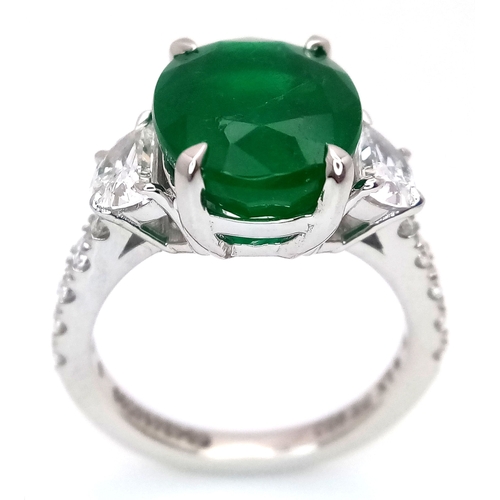 46 - A Stunning 950 Platinum Natural Emerald and Diamond Cocktail Ring. Set with an oval cut 5.69ct natur... 