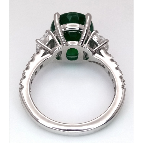 46 - A Stunning 950 Platinum Natural Emerald and Diamond Cocktail Ring. Set with an oval cut 5.69ct natur... 