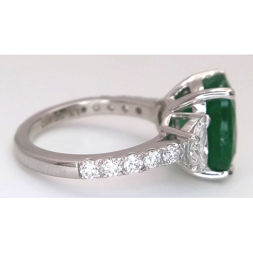 46 - A Stunning 950 Platinum Natural Emerald and Diamond Cocktail Ring. Set with an oval cut 5.69ct natur... 