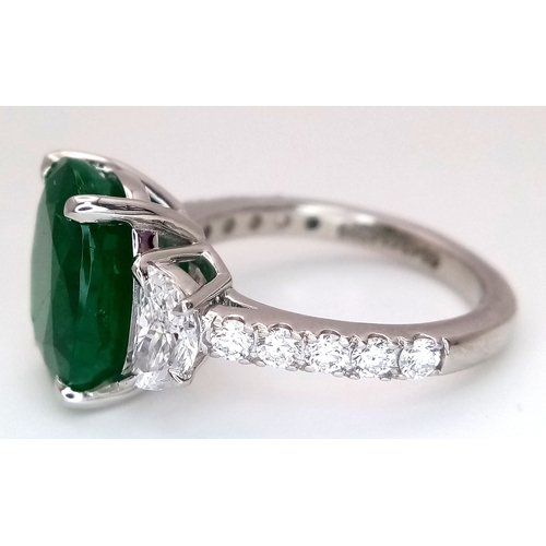 46 - A Stunning 950 Platinum Natural Emerald and Diamond Cocktail Ring. Set with an oval cut 5.69ct natur... 