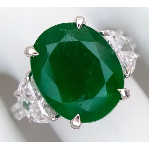 46 - A Stunning 950 Platinum Natural Emerald and Diamond Cocktail Ring. Set with an oval cut 5.69ct natur... 