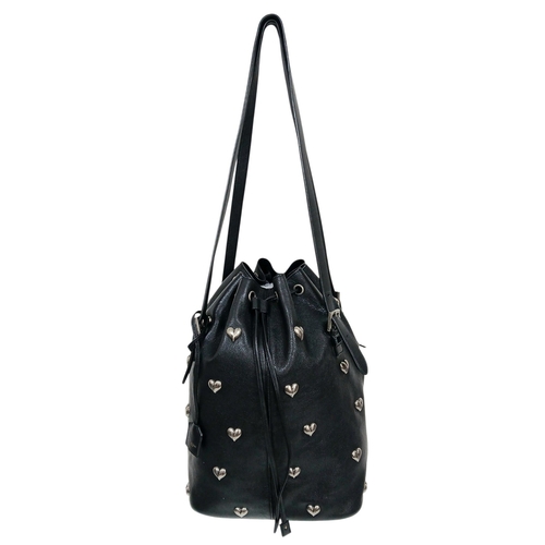 55 - A Black Yves Saint Laurent Heart Studded Tote Bag. Black leather exterior with silver-toned heart-sh... 