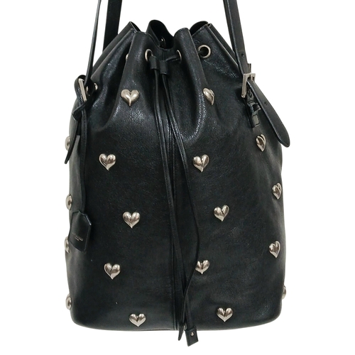 55 - A Black Yves Saint Laurent Heart Studded Tote Bag. Black leather exterior with silver-toned heart-sh... 