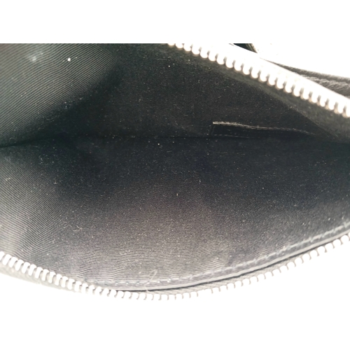 55 - A Black Yves Saint Laurent Heart Studded Tote Bag. Black leather exterior with silver-toned heart-sh... 