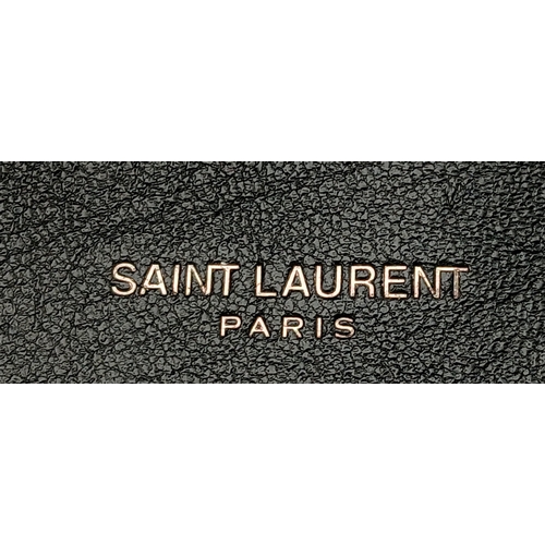 55 - A Black Yves Saint Laurent Heart Studded Tote Bag. Black leather exterior with silver-toned heart-sh... 