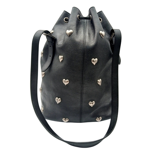 55 - A Black Yves Saint Laurent Heart Studded Tote Bag. Black leather exterior with silver-toned heart-sh... 