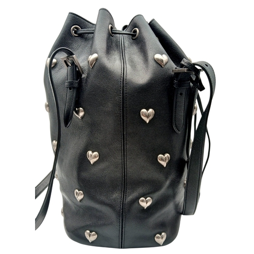 55 - A Black Yves Saint Laurent Heart Studded Tote Bag. Black leather exterior with silver-toned heart-sh... 