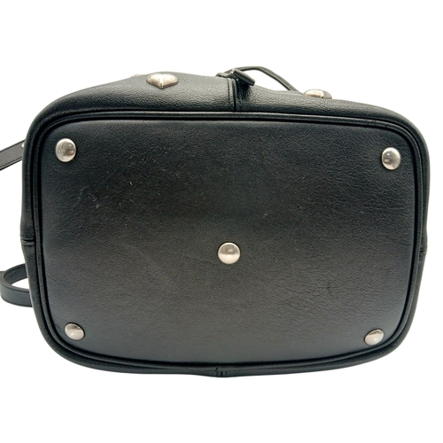 55 - A Black Yves Saint Laurent Heart Studded Tote Bag. Black leather exterior with silver-toned heart-sh... 