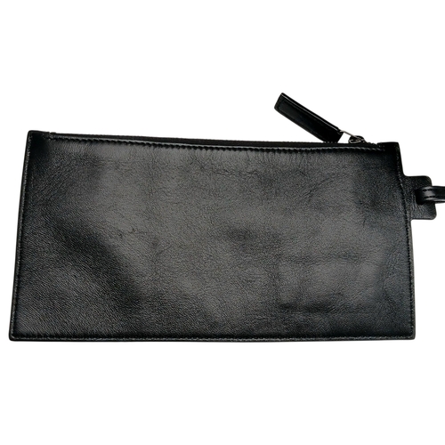 55 - A Black Yves Saint Laurent Heart Studded Tote Bag. Black leather exterior with silver-toned heart-sh... 