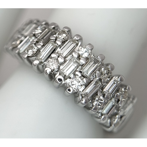 111 - An 18K White Gold, Mixed Cut, Diamond Set Ring. 0.45ctw. 4.8g, Size M. SC 2060