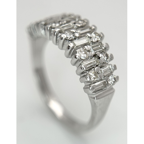 111 - An 18K White Gold, Mixed Cut, Diamond Set Ring. 0.45ctw. 4.8g, Size M. SC 2060