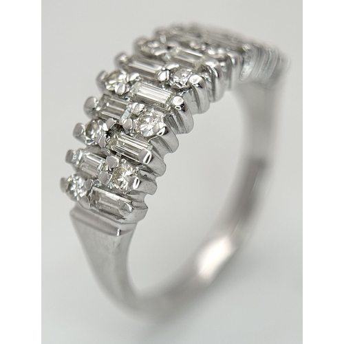 111 - An 18K White Gold, Mixed Cut, Diamond Set Ring. 0.45ctw. 4.8g, Size M. SC 2060
