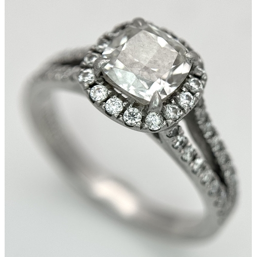 15 - A Platinum 950 and Diamond Dress Ring. A circa 1ct cushion cut diamond centre stone having J colour ... 