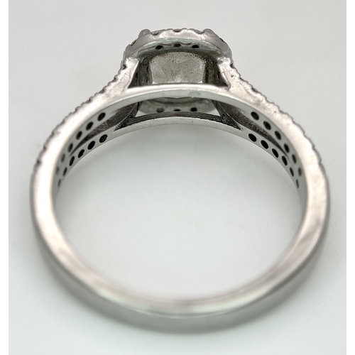 15 - A Platinum 950 and Diamond Dress Ring. A circa 1ct cushion cut diamond centre stone having J colour ... 