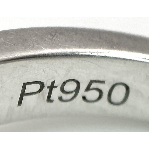 15 - A Platinum 950 and Diamond Dress Ring. A circa 1ct cushion cut diamond centre stone having J colour ... 