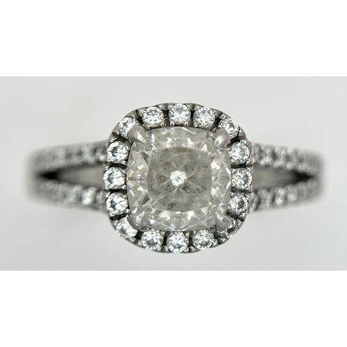 15 - A Platinum 950 and Diamond Dress Ring. A circa 1ct cushion cut diamond centre stone having J colour ... 