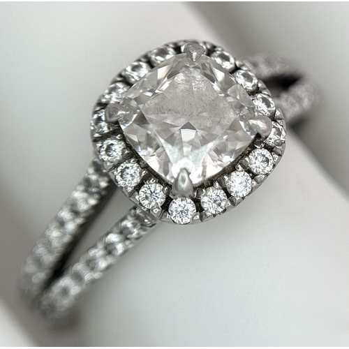 15 - A Platinum 950 and Diamond Dress Ring. A circa 1ct cushion cut diamond centre stone having J colour ... 